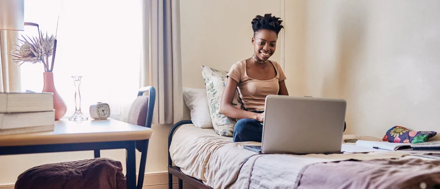 A student doing work in their apartment
