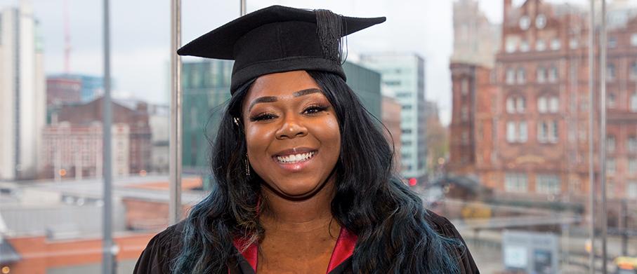 Graduate Kimoni Bell smiling at the camera