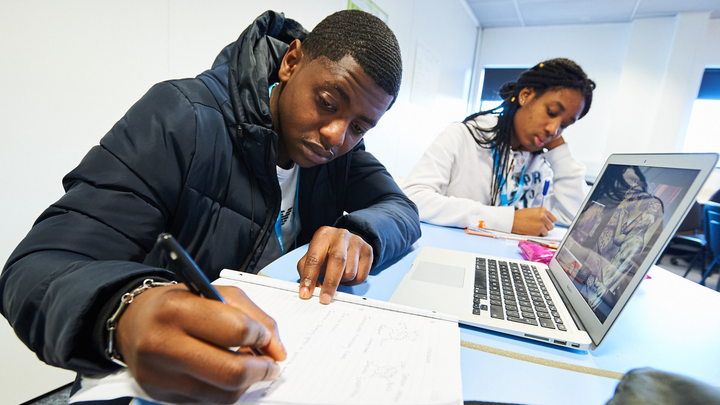 Close-up of a student using a laptop