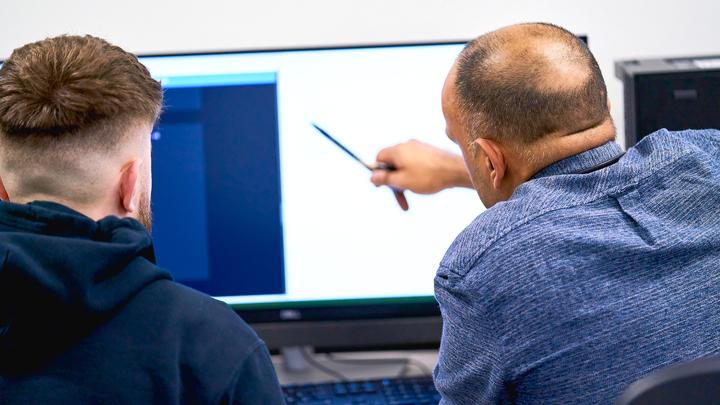 A tutor helping a student