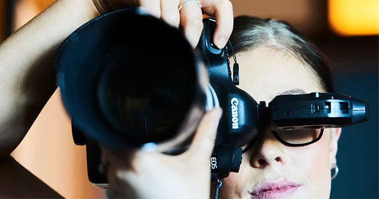 Looking down the lens of a camera