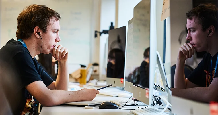 A student using a MacBook