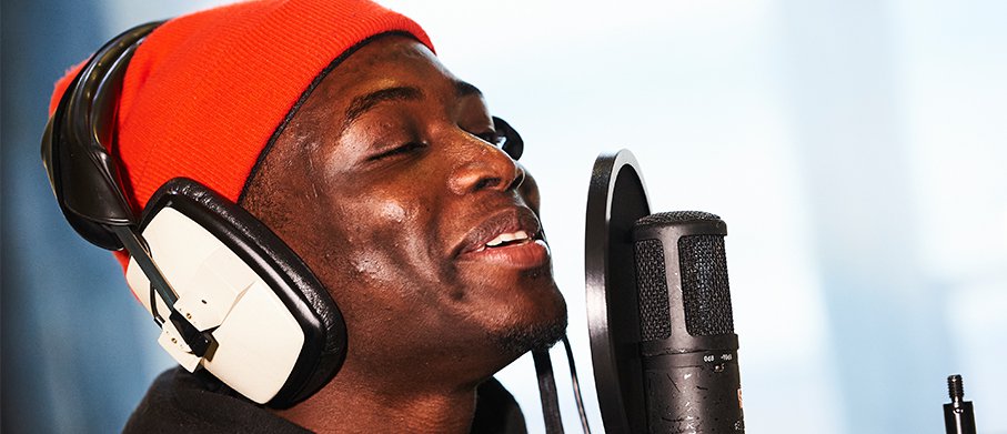 Close-up of an artist singing into a microphone