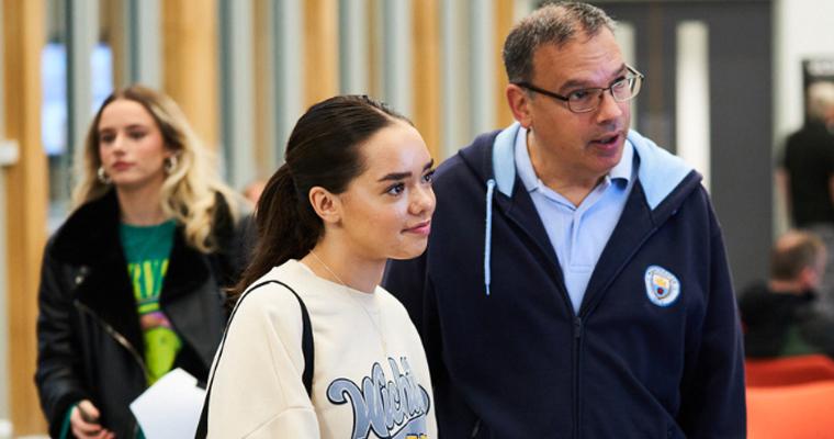 A UCEN Manchester tutor giving advice to a parent