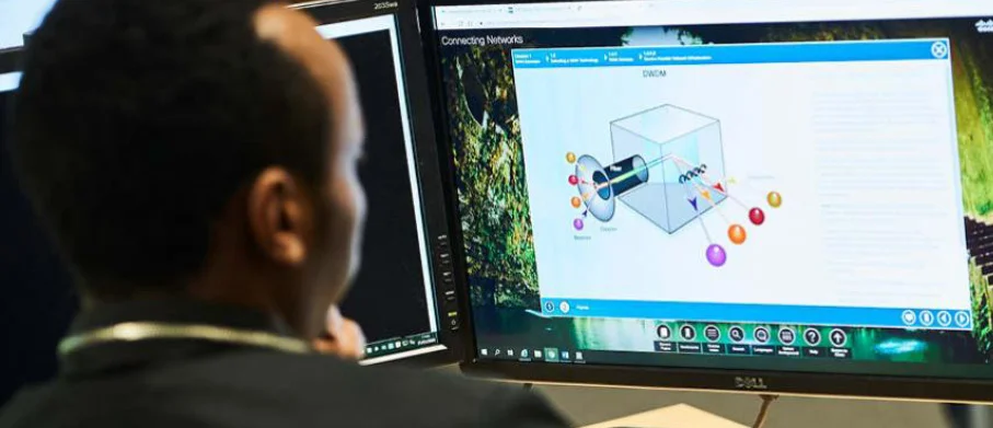 A student looking at a computer screen