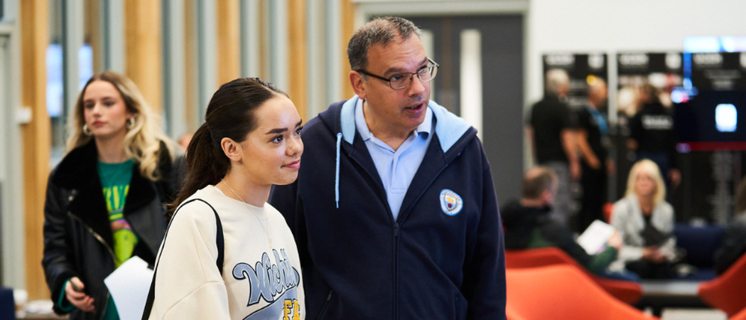 A UCEN Manchester tutor giving advice to a parent