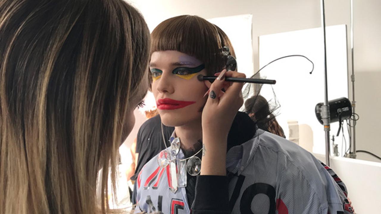 Lucy Bridge applying make-up to a model