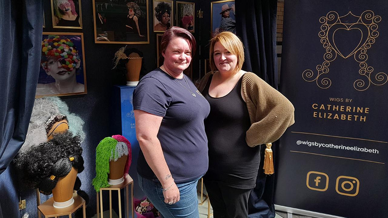 Photograph of Catherine Martin and Sharon Ashton in front of Catherine's stand at Victoria Baths.