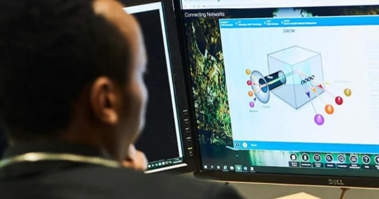 A student looking at a computer screen