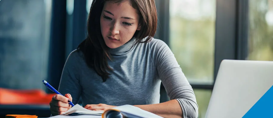 A woman studying at a desk