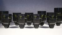 Several camera lenses placed on a surface