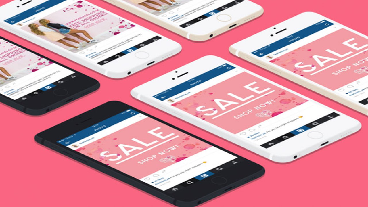 An image of six phones which say sale shop now with a pink background