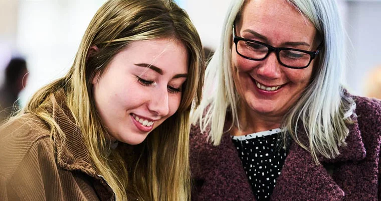 People smiling at an Open Day