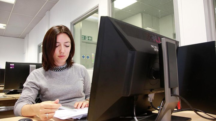 A learner working on a computer