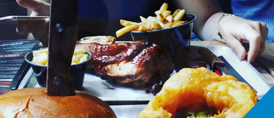 Close-up of a burger and onion rings
