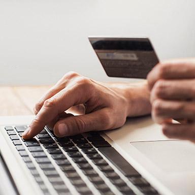 Someone using a card to pay an invoice