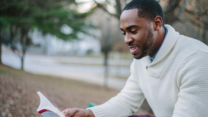 Adult learner reading a book