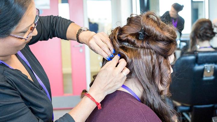 Close-up of a woman having her hair done