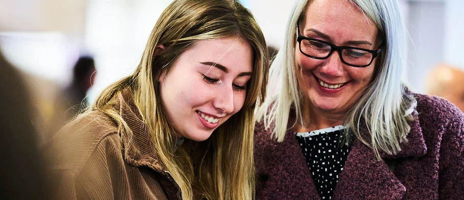 People smiling at an Open Day