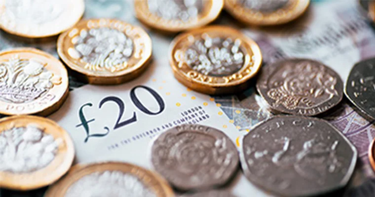 Money spread out on a table