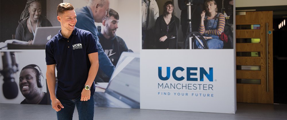 A UCEN manchester rep smiling at an open event