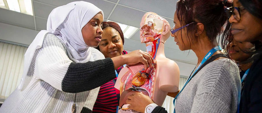 Medical learners working on a prototype