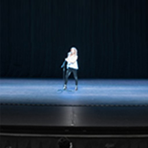 A woman singing on stage