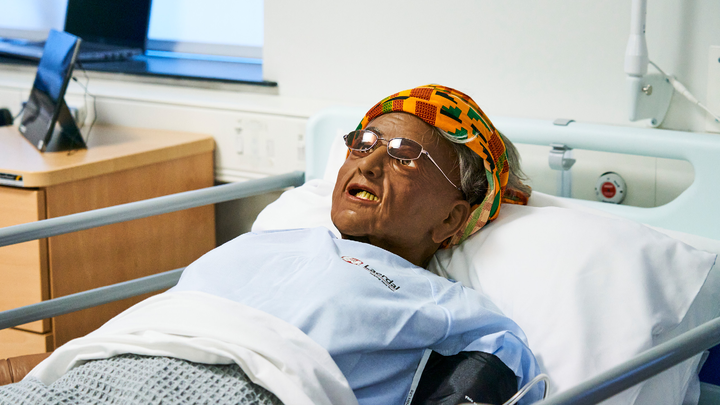 Someone lying down in a hospital bed