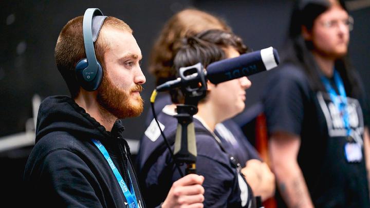 Young people filming on set