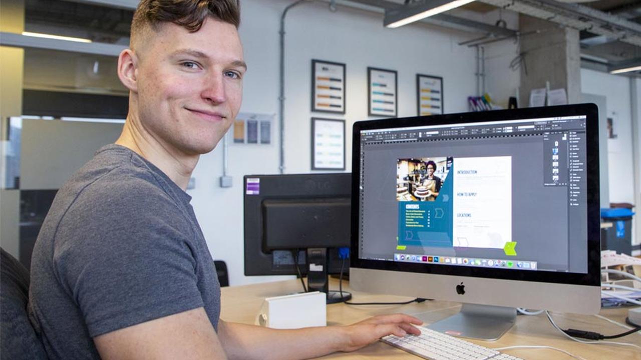 Graduate Michael Hawkins at his work station