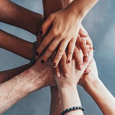 People stacking hands