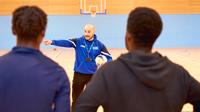 UCEN Students being directed in the Sports Hall by a UCEN Sport Tutor