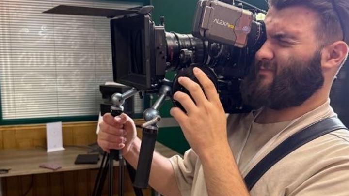 A man working on the camera