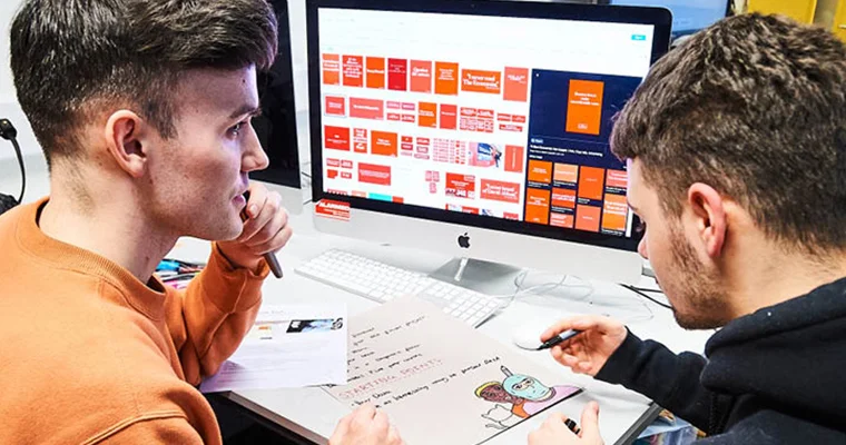 Learners working on a computer