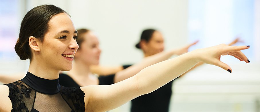 A performing arts student dancing in the studio