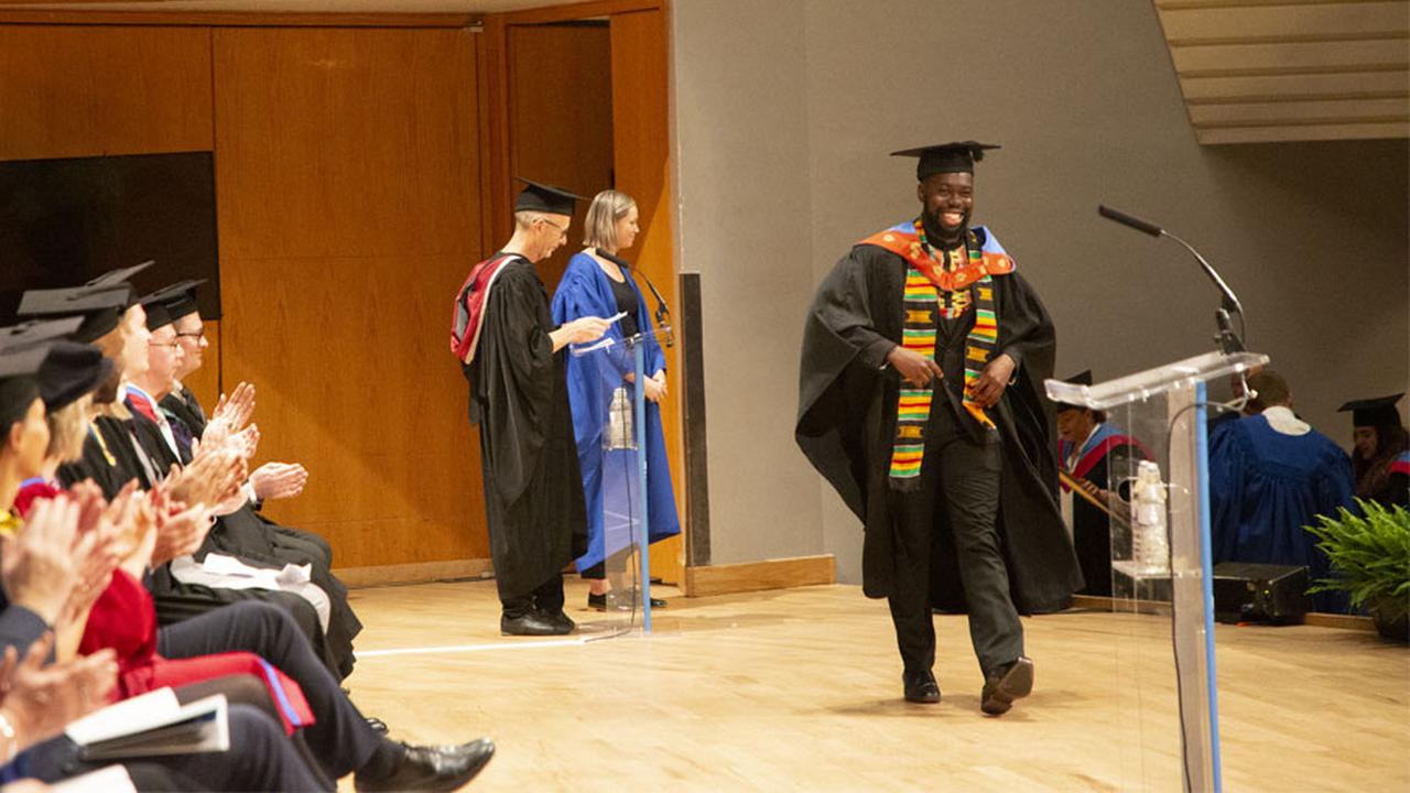 Zac Wundowa collecting his certificate during graduation