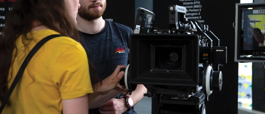 Two UCEN Manchester students using camera equipment