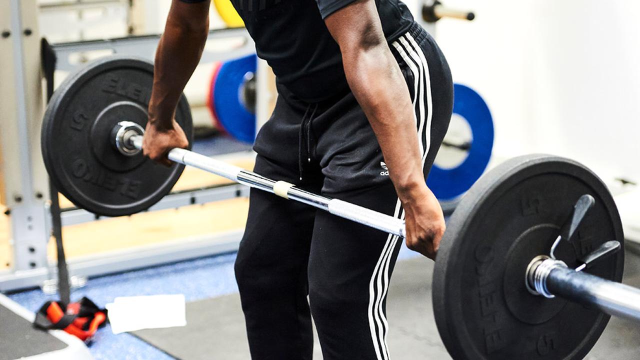 Student lifting a weight