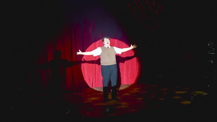 An actor performing on stage