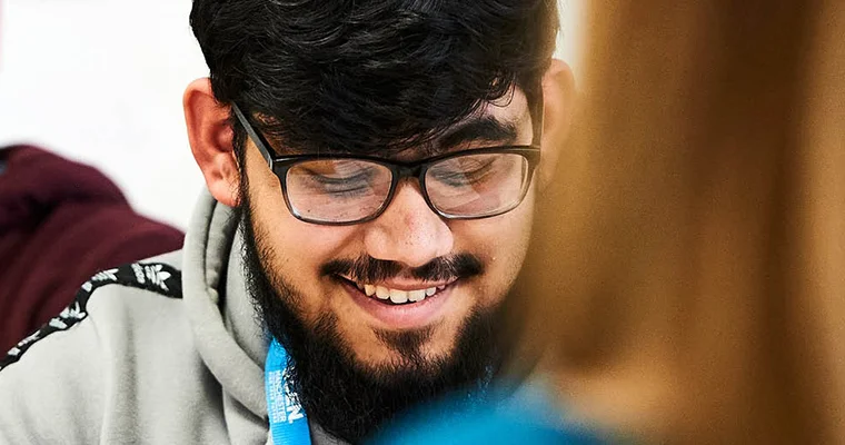 Close-up of a learner smiling