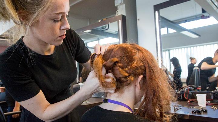 A clients hair being worked on by a hairdresser