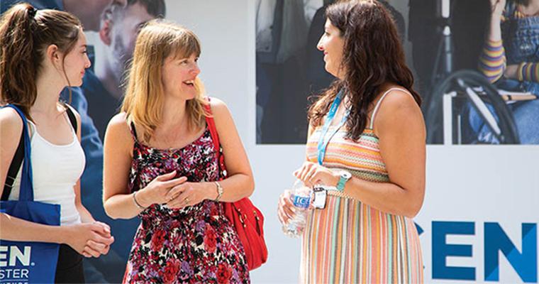 UCEN Manchester tutor speaking to a parent and learner