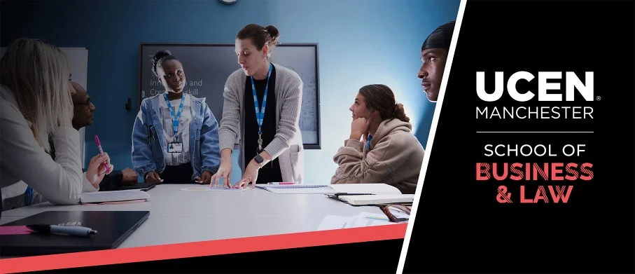 Business tutor working with students in a classroom