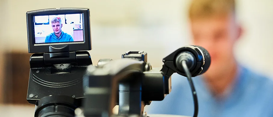 A camera filming an actor