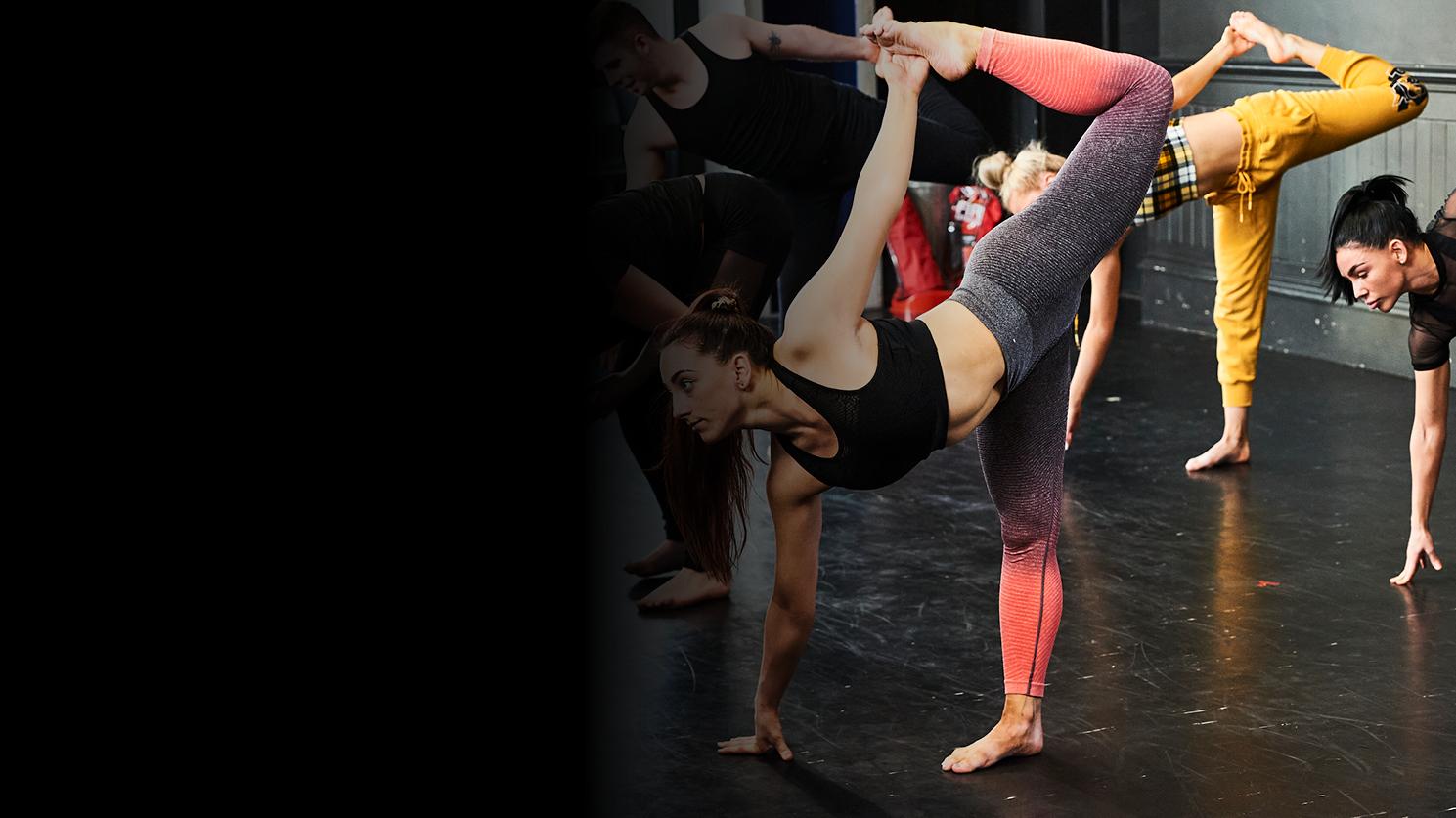 A group of people performing stretches