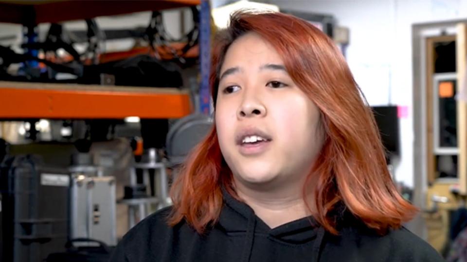 Sammy is looking beyond the camera as this is a screenshot from her video interview.