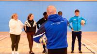 UCEN Students being directed in the Sports Hall by a UCEN Sport Tutor