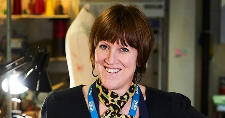 A tutor smiling at the camera