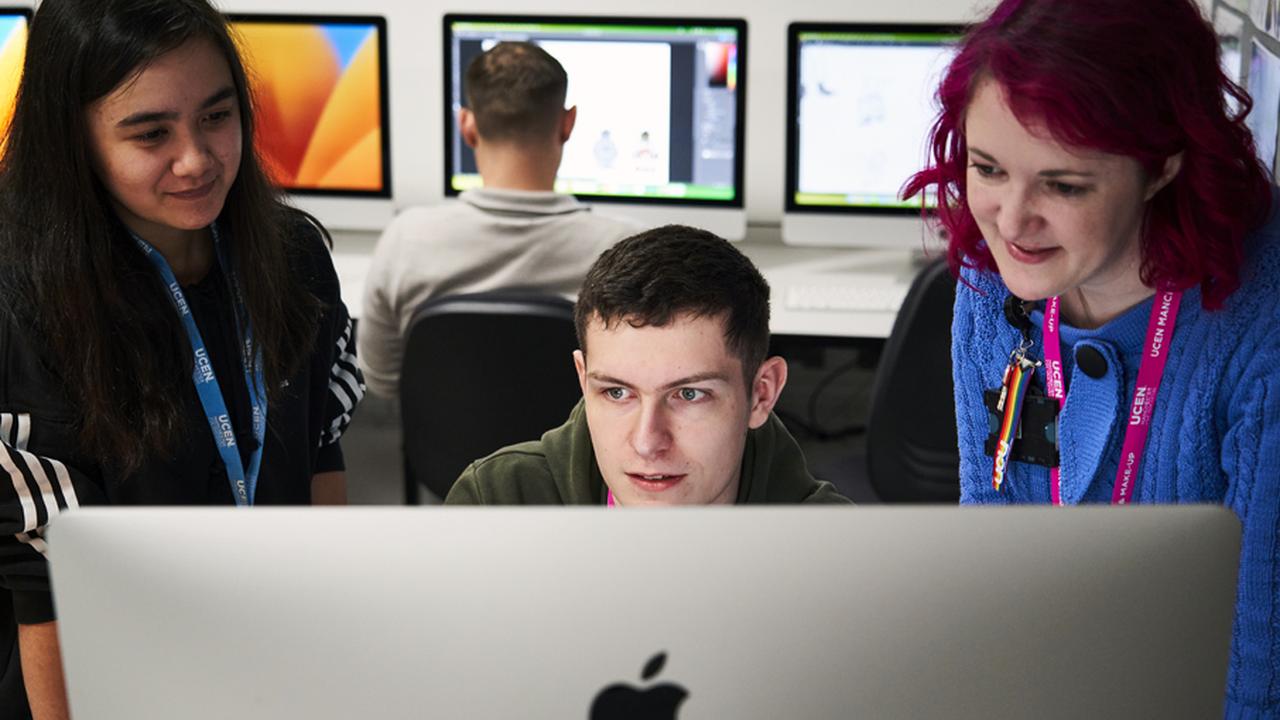 Student working with tutor in an animation course.