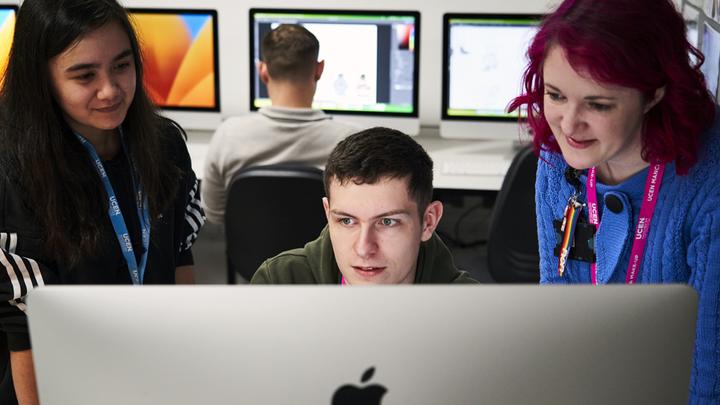 Student working with tutor in an animation course.